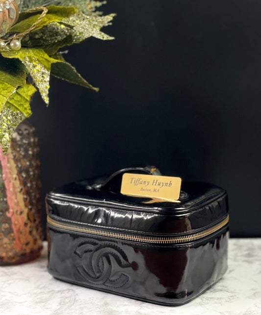 Authentic CHANEL Vanity Cosmetic Case crafted of Black Patent Leather