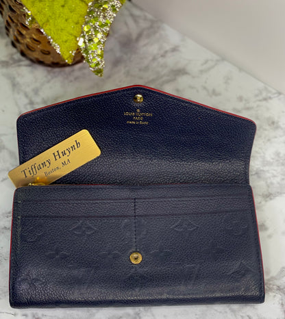 Authentic Louis Vuitton Empreinte Sarah Wallet in Marine Rouge