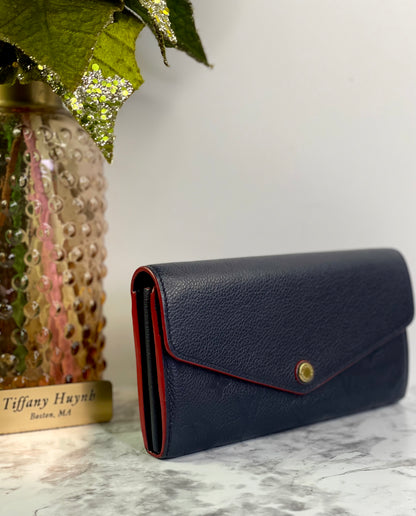 Authentic Louis Vuitton Empreinte Sarah Wallet in Marine Rouge