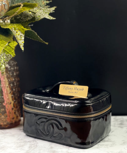 Authentic CHANEL Vanity Cosmetic Case crafted of Black Patent Leather
