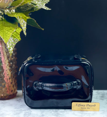 Authentic CHANEL Vanity Cosmetic Case crafted of Black Patent Leather